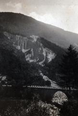 Earth pyramids and bridge over Regnana river in Segonzano, Trentino, Italy in early 20th century