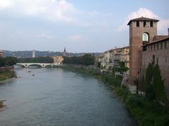 View of Ponte della Vittoria on Adige River in Verona from Ponte Scaligero with Castelvecchio in the background