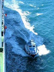 Pilot boat approaching ferry Ionian Sky to pick up pilot near Brindisi harbor Italy