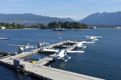 Aerial view of Burrard Inlet with seaplanes and city skyline in Vancouver, British Columbia
