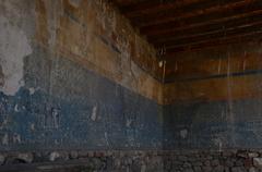 Erebuni Apadana ancient wall painting with modern damage visible