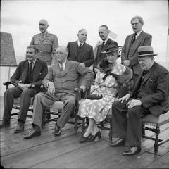 Winston Churchill seated at the Quebec Conference terrace with dignitaries overlooking Quebec harbour August 1943