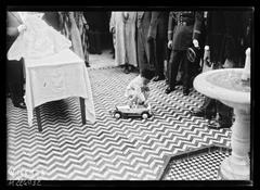 Mohammed V, Sultan of Morocco, receiving at the Paris Mosque with young Prince Hassan, future King Hassan II, on September 16, 1932