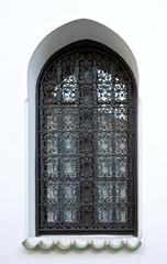 Window of the Mosque of Paris with intricate Islamic architectural details