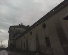 Panoramic view of the Royal Palace of Carditello surrounded by lush greenery and landscape