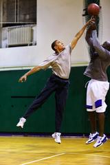 President Barack Obama playing basketball with personal aide Reggie Love at St. Bartholomew's Church in New York