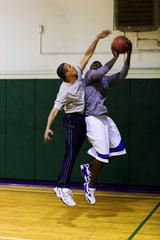 President Barack Obama blocking a basketball shot against Reggie Love