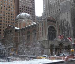 Snow-covered Park Avenue looking south towards St Bart's on a cloudy afternoon