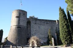 Mastio tower of Rocca di Bergamo fortress under blue sky