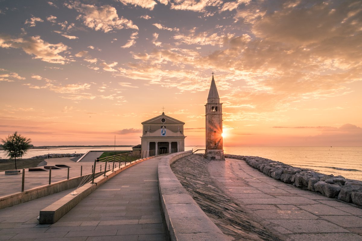 Scenic view of Caorle, Italy with colorful buildings along the waterfront