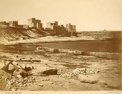 View of St. Paul's Bay in Malta with clear blue waters and historic buildings under a blue sky
