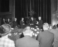 Professor Victor Jacob Koningsberger receiving the golden medal from Prince Bernhard at the farewell event at the Royal Tropical Institute Amsterdam