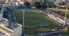 Panoramic view of Stadio Nicola De Simone with empty stands and green field