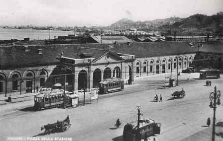 Ancona railway station exterior with train tracks and modern architectural design