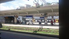 Several Trenitalia Rock trains arriving at La Spezia Centrale station platforms