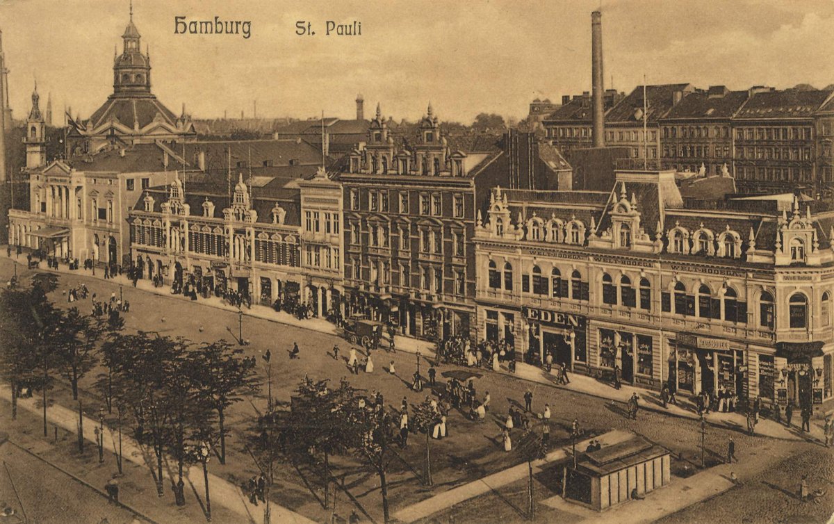 Street view of historic buildings in Hamburg with classic architecture and tram tracks