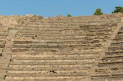 Ancient stone bleachers in the Odeion theater, Pompeii, Italy