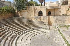 Ancient Roman theatre ruins in Lecce with stone seats and architectural remains