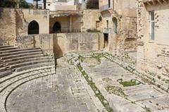Ancient Roman theatre ruins in Lecce with stone seating and stage remains