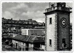 Panoramic view of Bergamo city with Torre dei Caduti and Città Alta under a blue sky