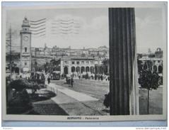Panoramic view of Bergamo cityscape with historic buildings and mountains in the background