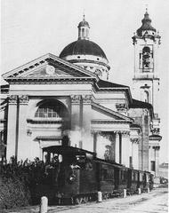 Historic steam tram passing in front of the Rho Sanctuary