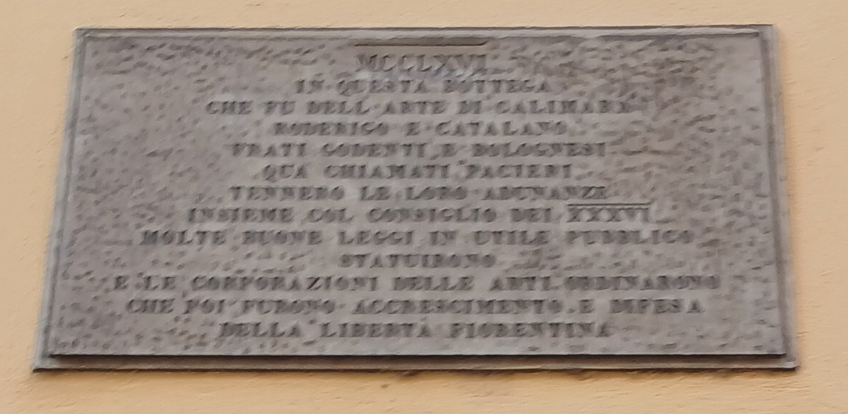 Historic engraved stone plaque in Via Porta Rossa, Florence