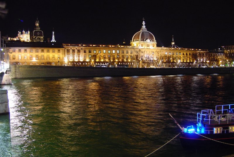 Hôtel Dieu and illuminated Fourvière Hill at night in Lyon, Rhône