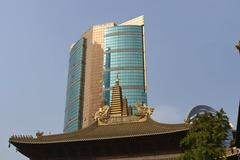 Jing'an Temple in Shanghai with traditional Chinese architecture under a clear blue sky
