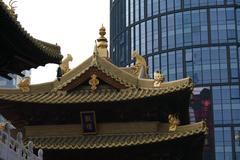 Jing'an Temple in Shanghai, China with ornate traditional Chinese architecture and golden roof, captured on a clear day