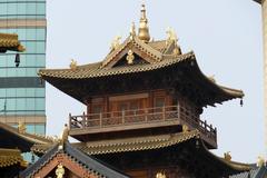 Jing'an Temple in Shanghai China on a clear day with blue sky and traditional architecture