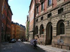 Storkyrkobrinken street in Gamla stan, Stockholm with historic buildings and cobblestone road