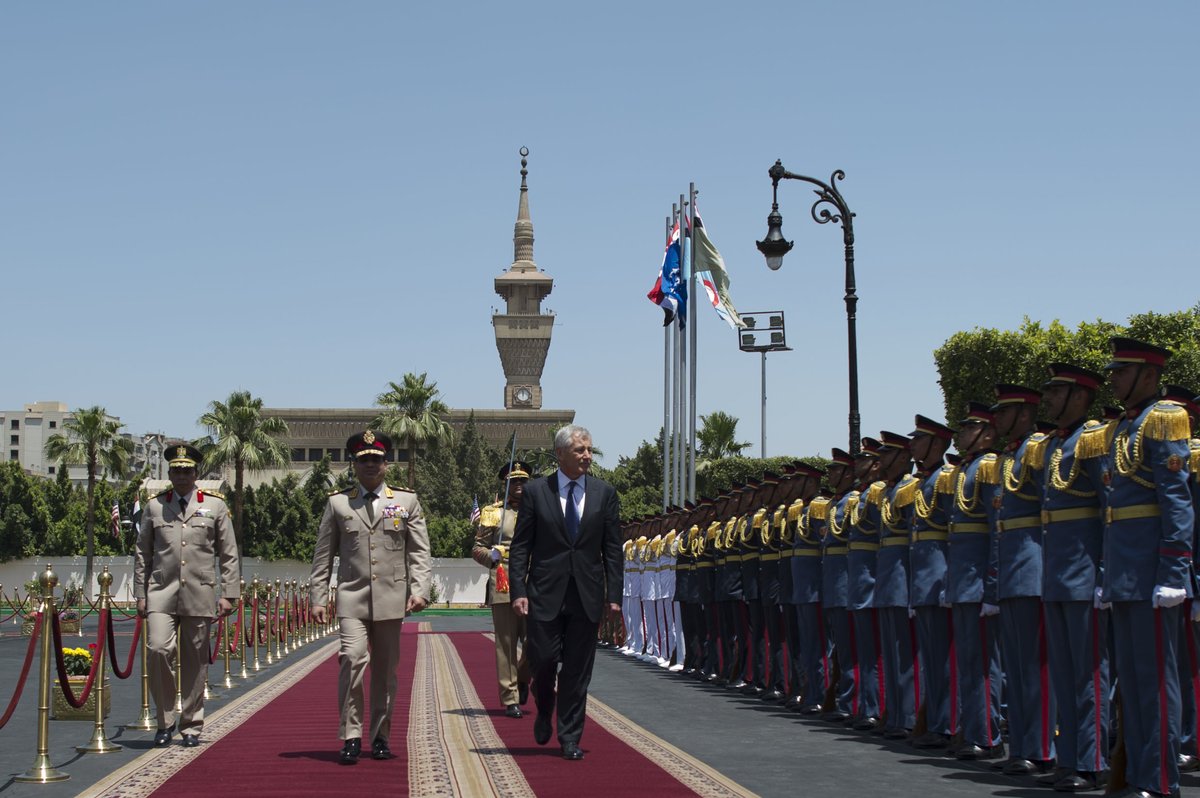 Egyptian Minister of Defense Abdel Fatah Saeed Al Sisy escorts US Secretary of Defense Chuck Hagel inspecting troops in Cairo 2013