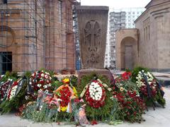 Armenian Khachkar and flowers in front of the Holy Transfiguration Cathedral Armenian monastery in Moscow