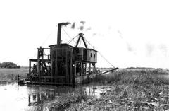 Black and white photo of a drill rig near the Tamiami Trail in Florida around 1920