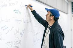 Physicist Pavel Jelínek writing on whiteboard at Center for Quantum Nanoscience Ewha Womans University