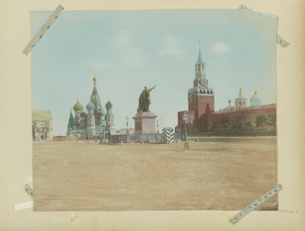 Historic view of Red Square in Moscow featuring Saint Basil's Cathedral, the monument to Minin and Pozharsky, and the Spasskaya Tower around 1890-1900