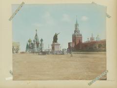 Historic view of Red Square in Moscow featuring Saint Basil's Cathedral, the monument to Minin and Pozharsky, and the Spasskaya Tower around 1890-1900