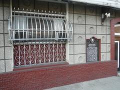 Bahay na Tisa ancestral house window with historical marker in Digman, Bacoor, Cavite