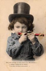 Child playing with a mirliton toy