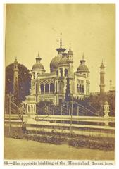 Hosenabad Imambara opposite building with grand archway and sphinx statues in Lucknow