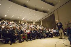 Dr. John Mather speaking to a packed auditorium at University of Maryland about his Nobel Prize-winning work on COBE