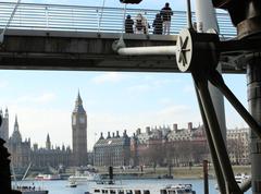 Clock tower in London with ornate golden details