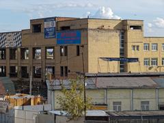 Gutted remains of the AZLK automobile plant in Moscow showing the original 1939 structure and demolished smaller structures