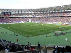 Ajinomoto Stadium during an evening event with floodlights