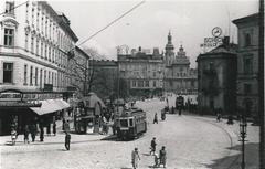 Halicki Square in Lviv with historic buildings and parked cars