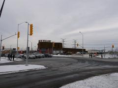 Opening day at TTC's Pioneer Village Station showing bus bays with buses and passengers