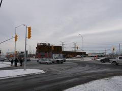 Opening day at TTC's Pioneer Village Station bus bays with people and vehicles, December 17, 2017