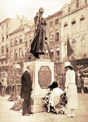 Queen Elisabeth of Belgium and Princess Marie-Jose placing flowers at Gabrielle Petit statue