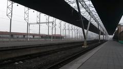 Platforms of Yerevan Railway Station with trains and passengers in Armenia